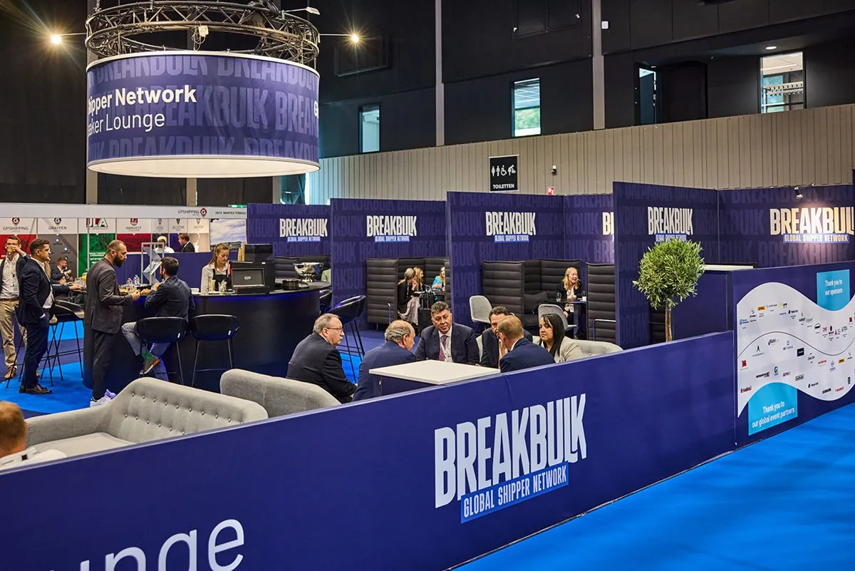 Breakbulk Global Shipper lounge with attendees networking and holding meetings.
