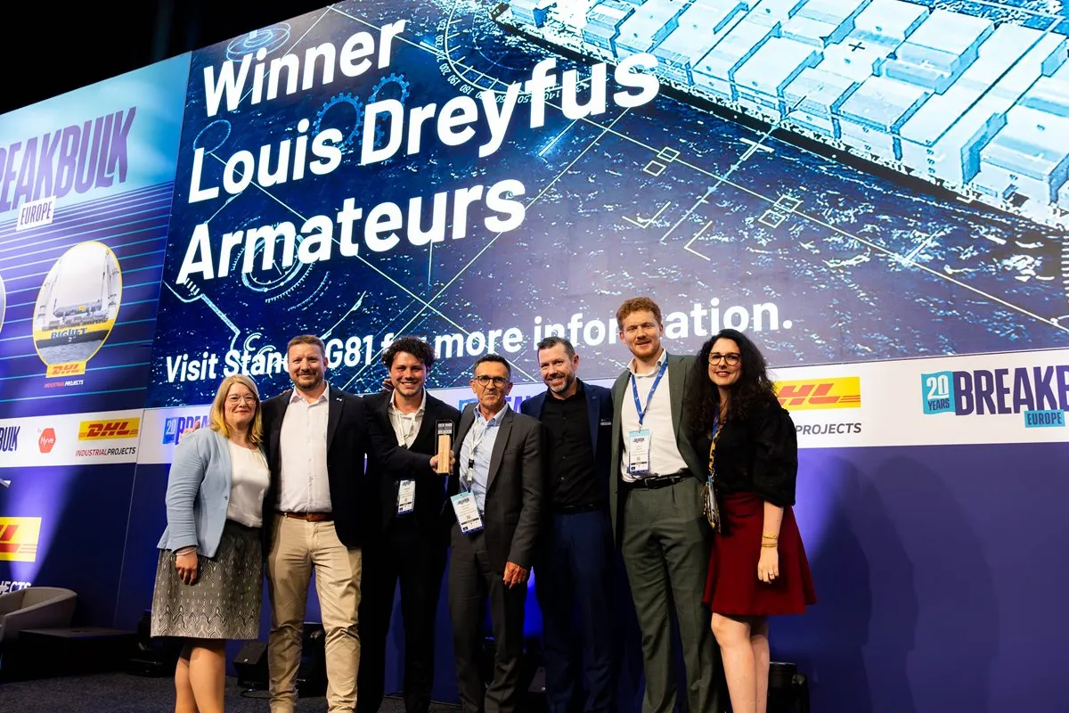Louis Dreyfus Armateurs team celebrates an award win on stage at Breakbulk Europe.