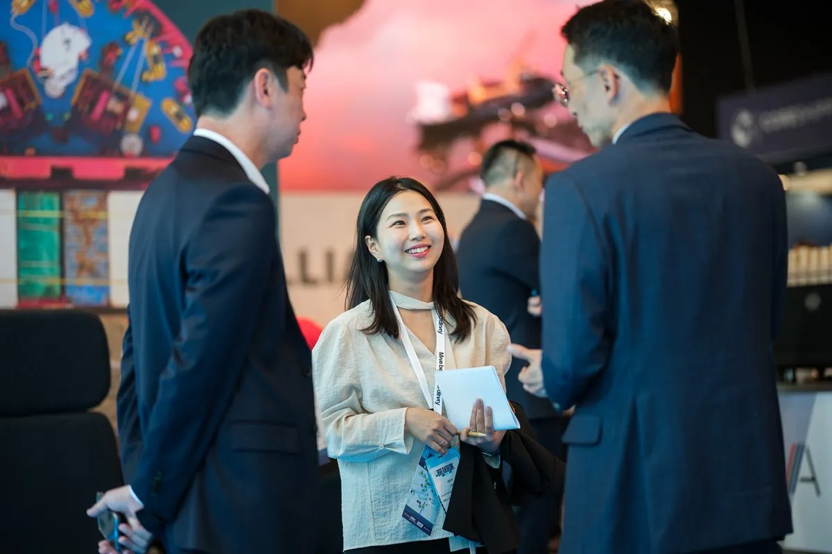 Attendees network and connect on the exhibition floor at Breakbulk Europe.