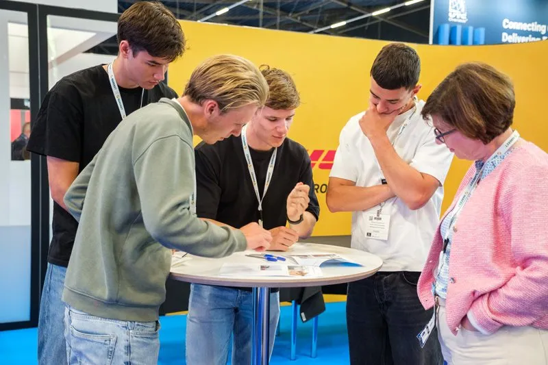 Students take part in an educational activity at Breakbulk Europe.