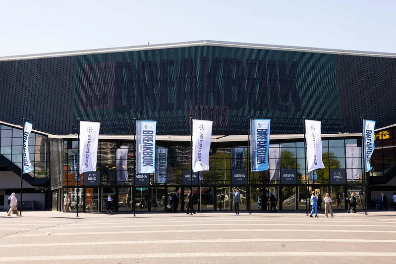 Breakbulk Europe venue entrance with event and AD Ports Group flags outside.