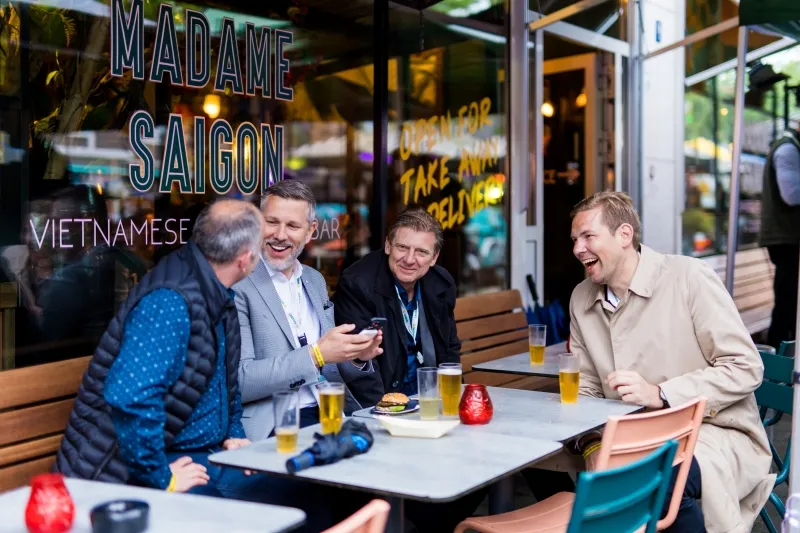 Breakbulk Europe attendees socialise over drinks at Breakbulk Boulevard.