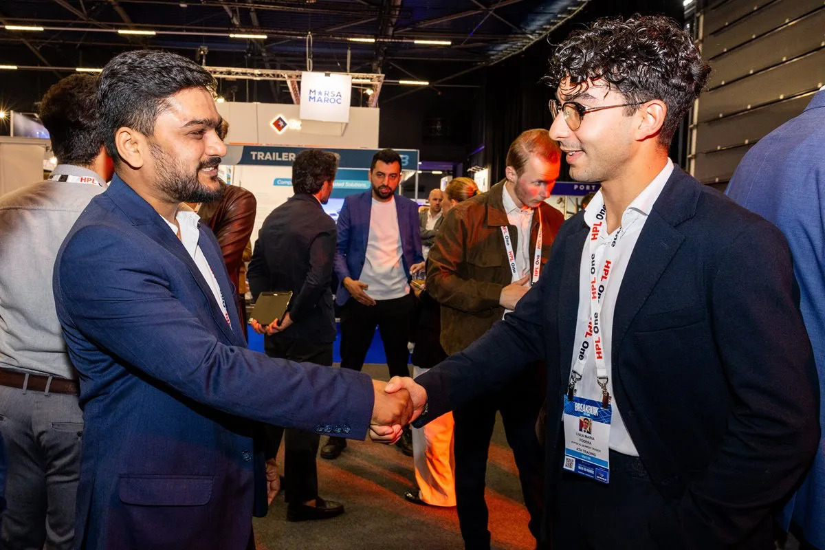 Attendees shake hands during the NextWave 30 Networking Hour at Breakbulk Europe.