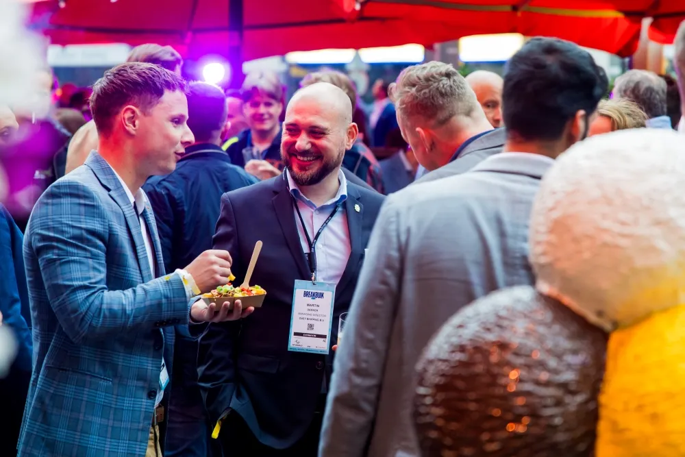 Attendees network and socialise at the Breakbulk Europe Boulevard Party.