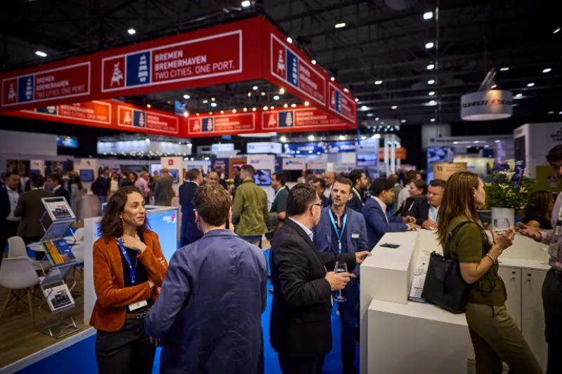 Attendees network and connect on the busy exhibition floor at Breakbulk Europe.
