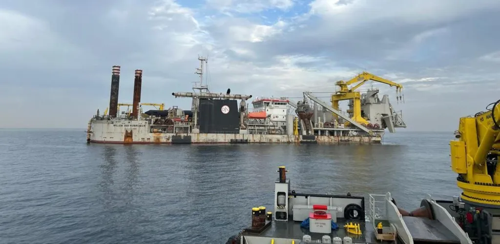 Willem van Rubroeck dredger carrying out maritime works at sea near the Port of Ndayane.