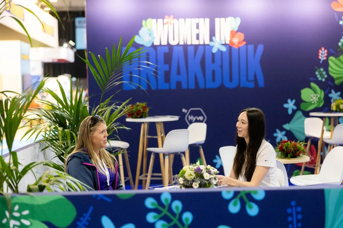 Attendees network in the Women in Breakbulk lounge at Breakbulk Europe.